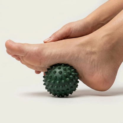 Green foot massage ball for foot mobility and tension release