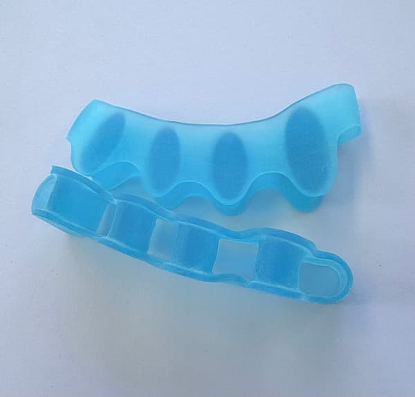 Pair of Toe Separators in blue 5 toes soft silicone. for use after narrow shoes, tired feet. natural splay